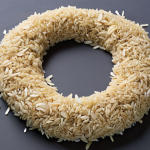 **Prompt:** A dynamic visual representation of the circular economy's core principles. Focus on products designed for longevity and easy disassembly, such as modular electronics, repairable appliances, and versatile clothing items that can be re-purposed. Integrate innovative materials like bioplastics derived from organic waste (e.g., coffee grounds) and sustainable building materials made from industrial by-products (e.g., rice husks). The image should illustrate a continuous, closed-loop system where materials flow seamlessly from use back into production, symbolizing regeneration and minimal waste. The aesthetic should be clean, futuristic, and hopeful, with elements suggesting intelligent design and resourcefulness.
